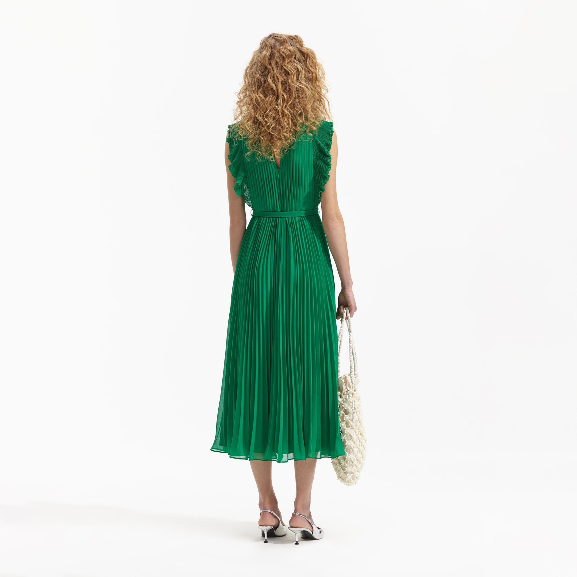 Back view of a woman wearing the Green Chiffon Sleeveless Ruffle Midi Dress