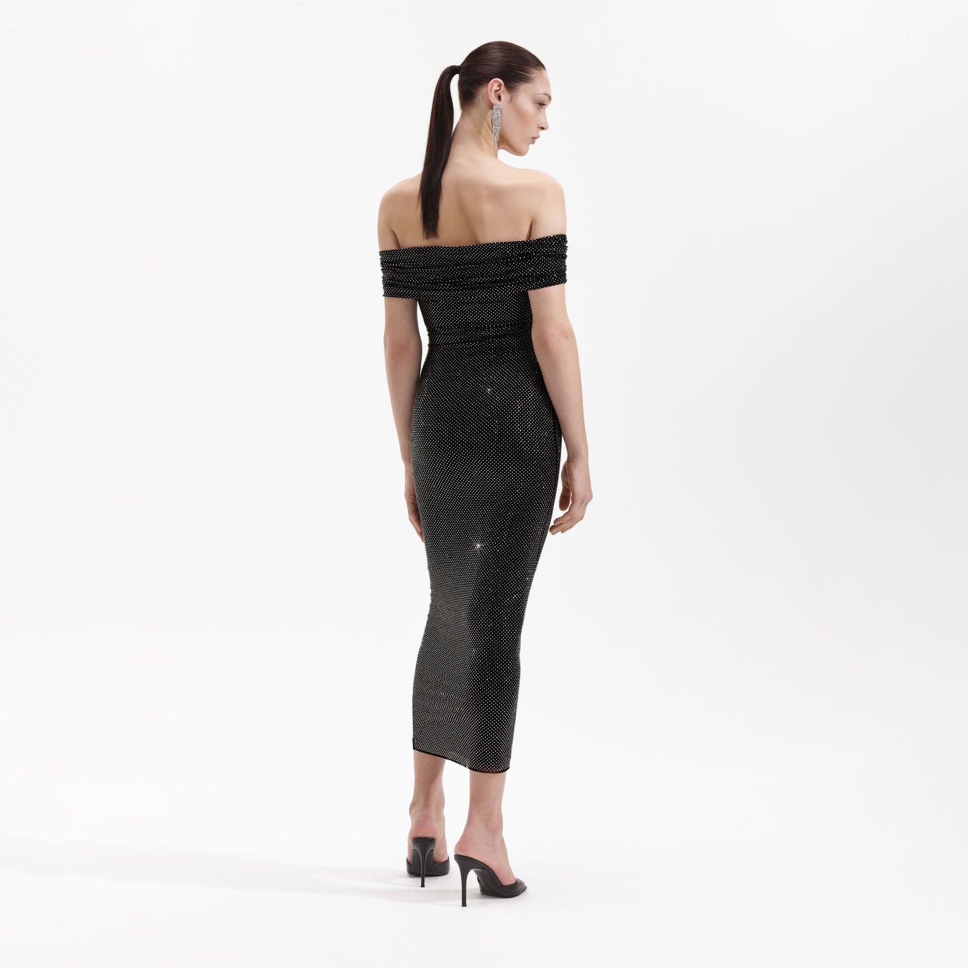 Back view of a woman wearing the Black Rhinestone Bardot Midi Dress