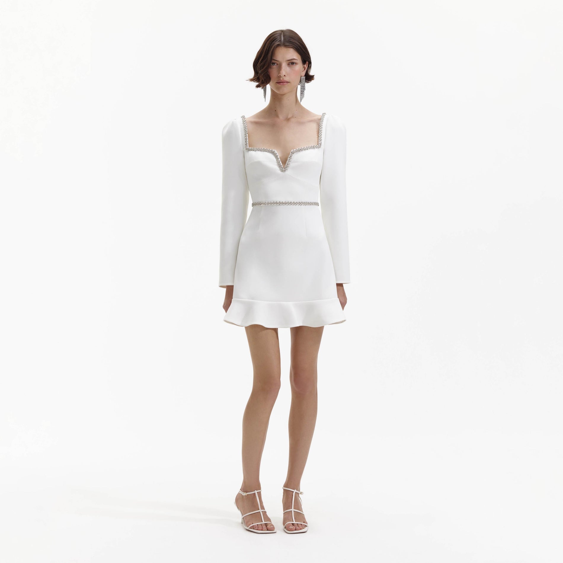 Front view of a woman wearing the White Bonded Crepe Long Sleeve Mini Dress