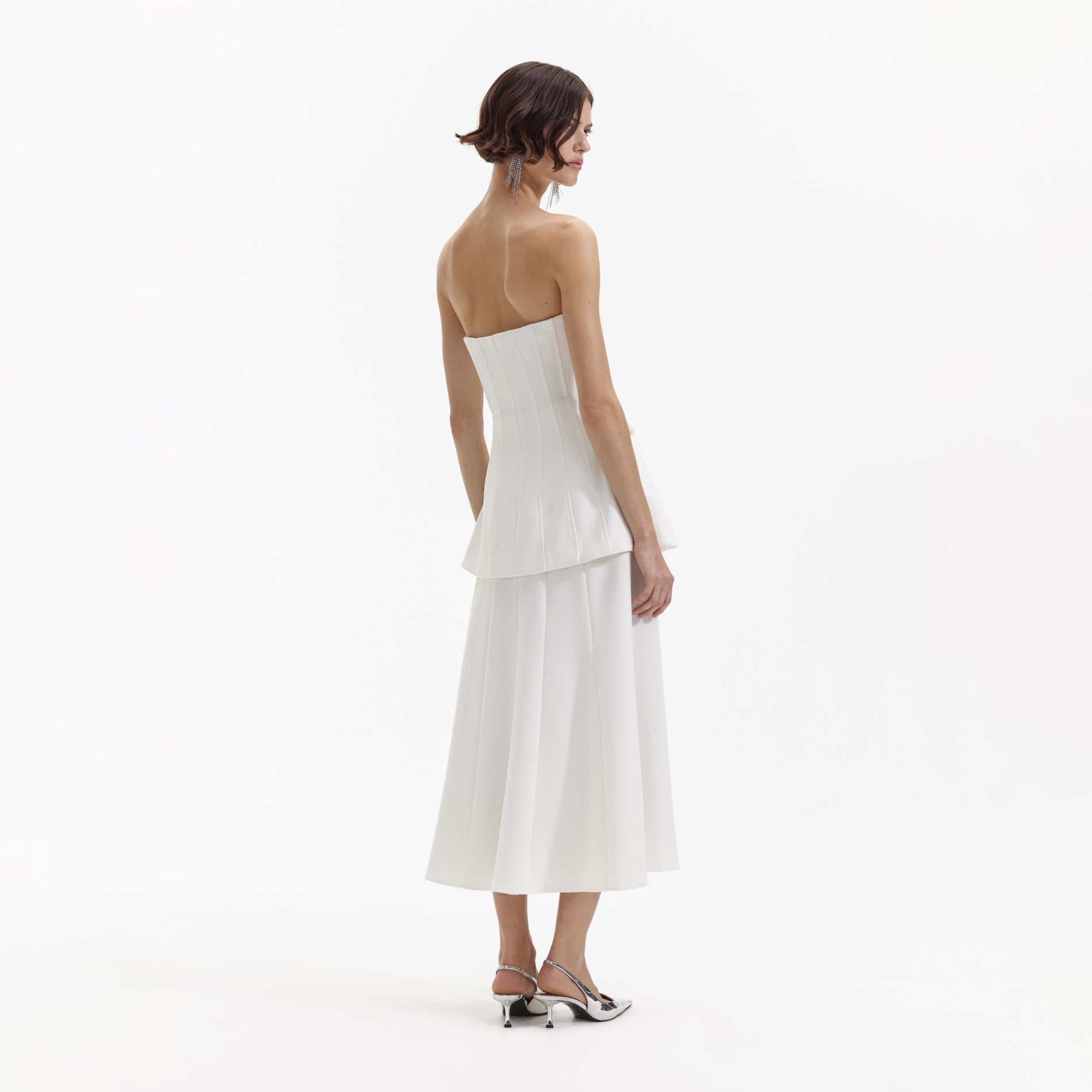 Back view of a woman wearing the White Bandeau Crepe Midi Dress