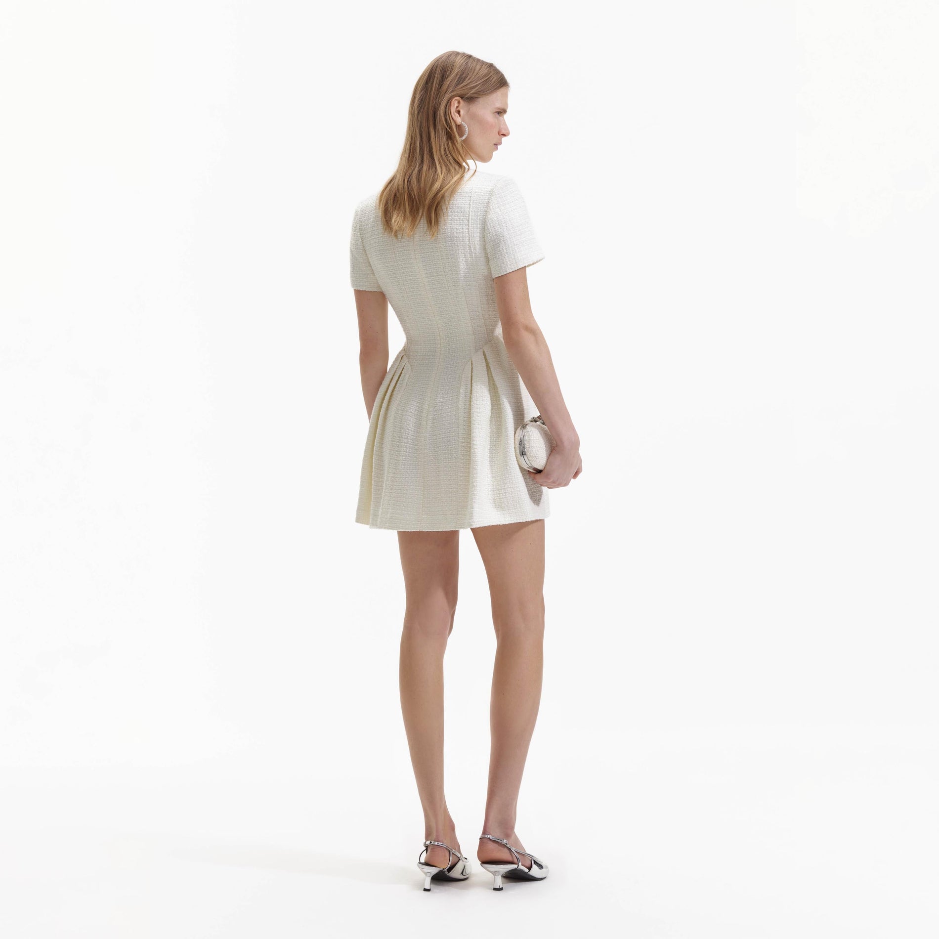 Back view of a woman wearing the Cream Boucle Short Sleeve Mini Dress