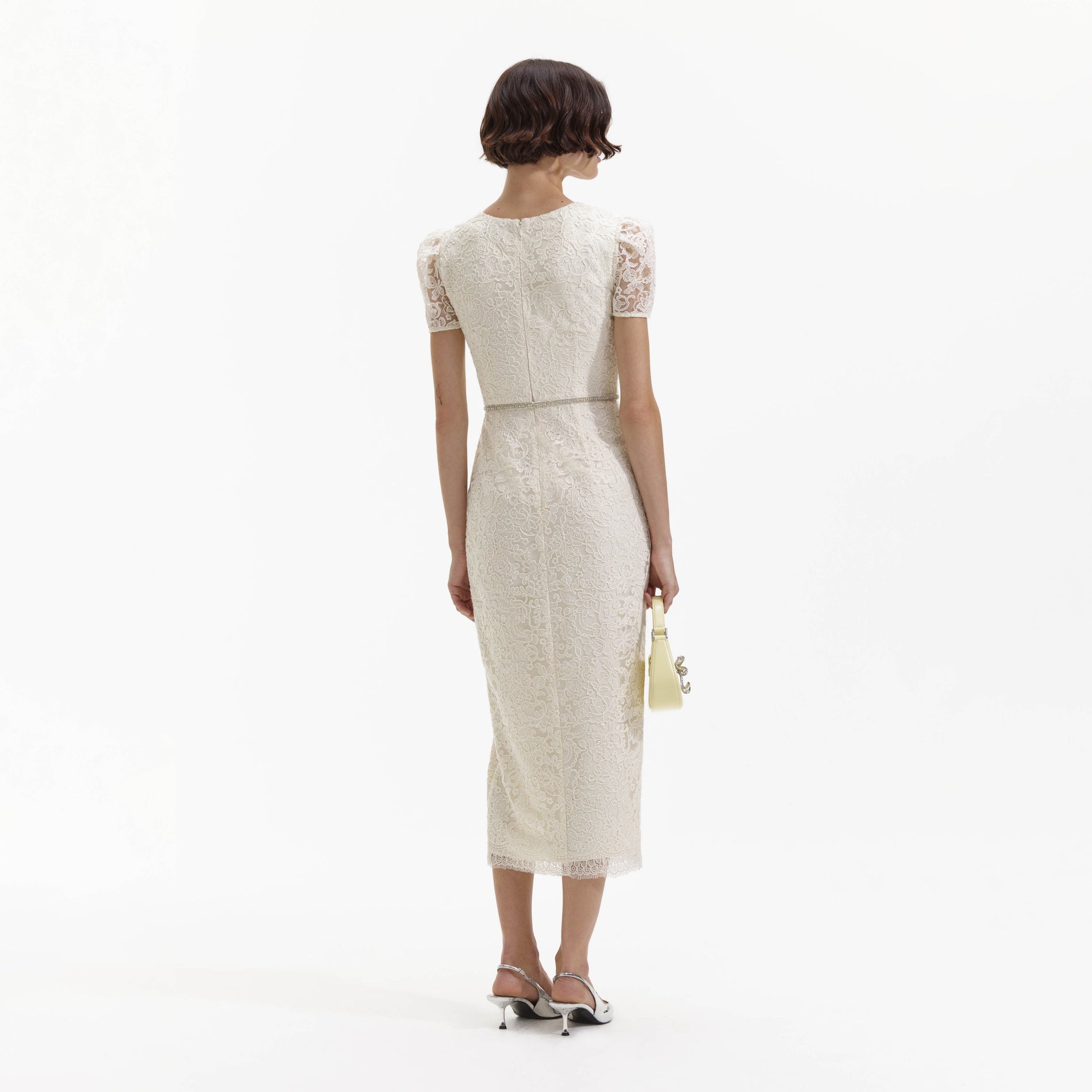 Back view of a woman wearing the Cream Lace Diamante Midi Dress