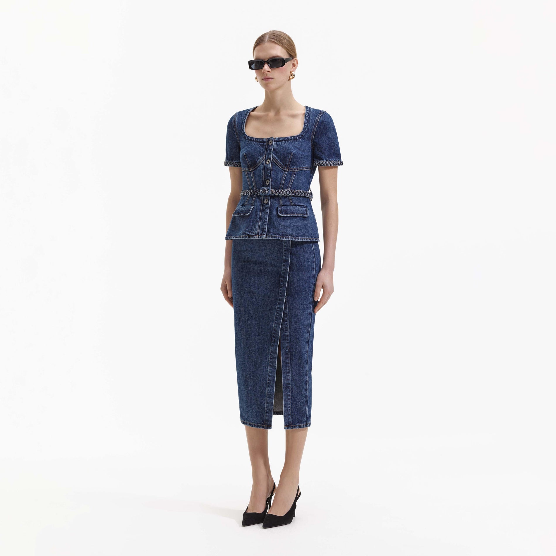 Side view of a woman wearing the Denim Midi Dress