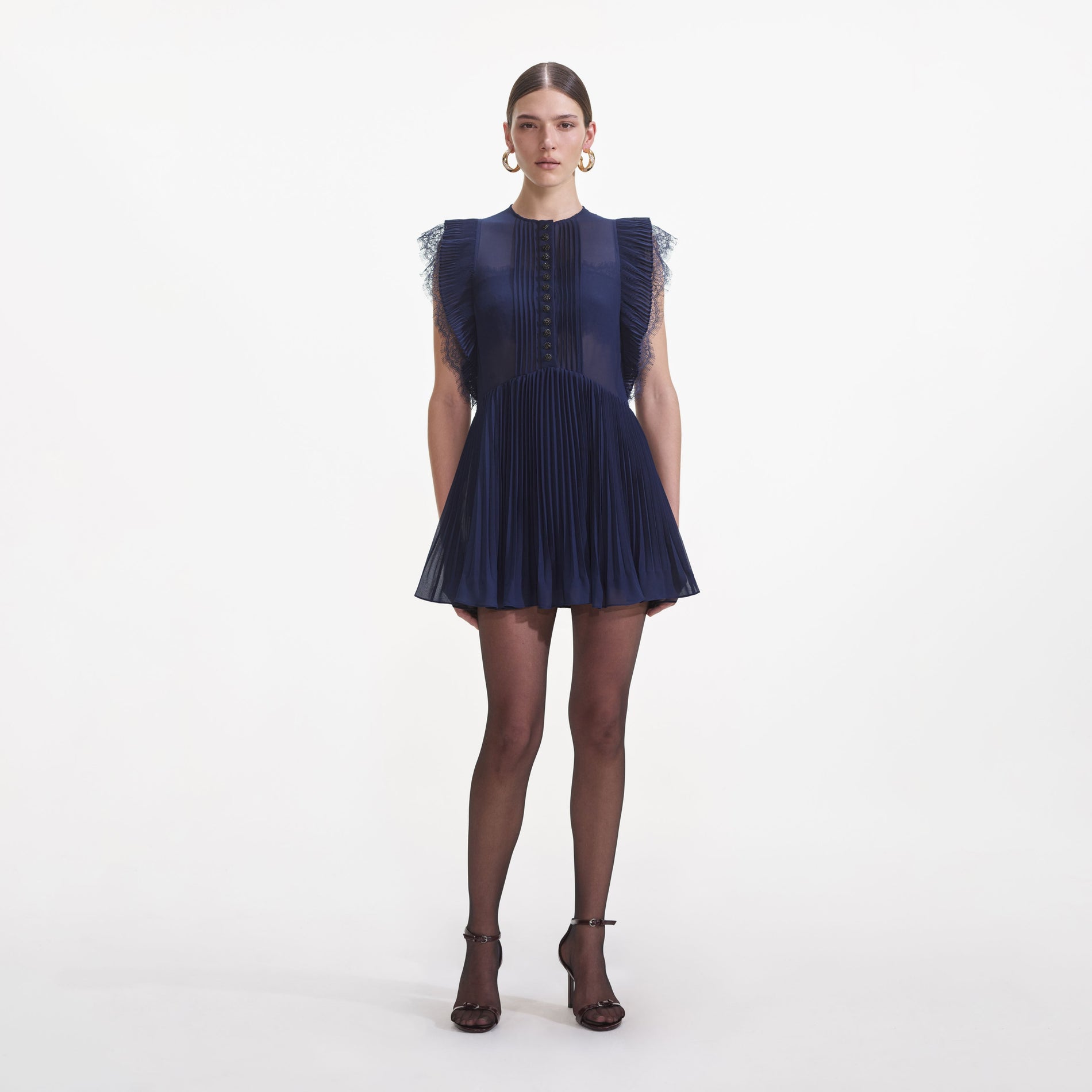 Front view of a woman wearing the Navy Chiffon Ruffle Mini Dress