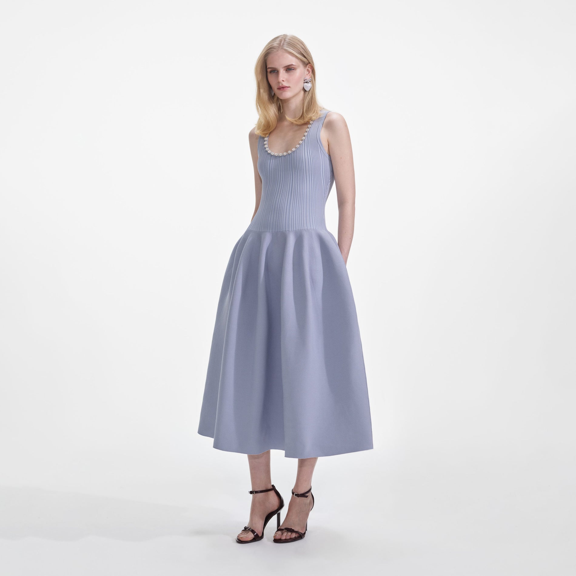 Side view of a woman wearing the Blue Ribbed Knit Diamante Midi Dress