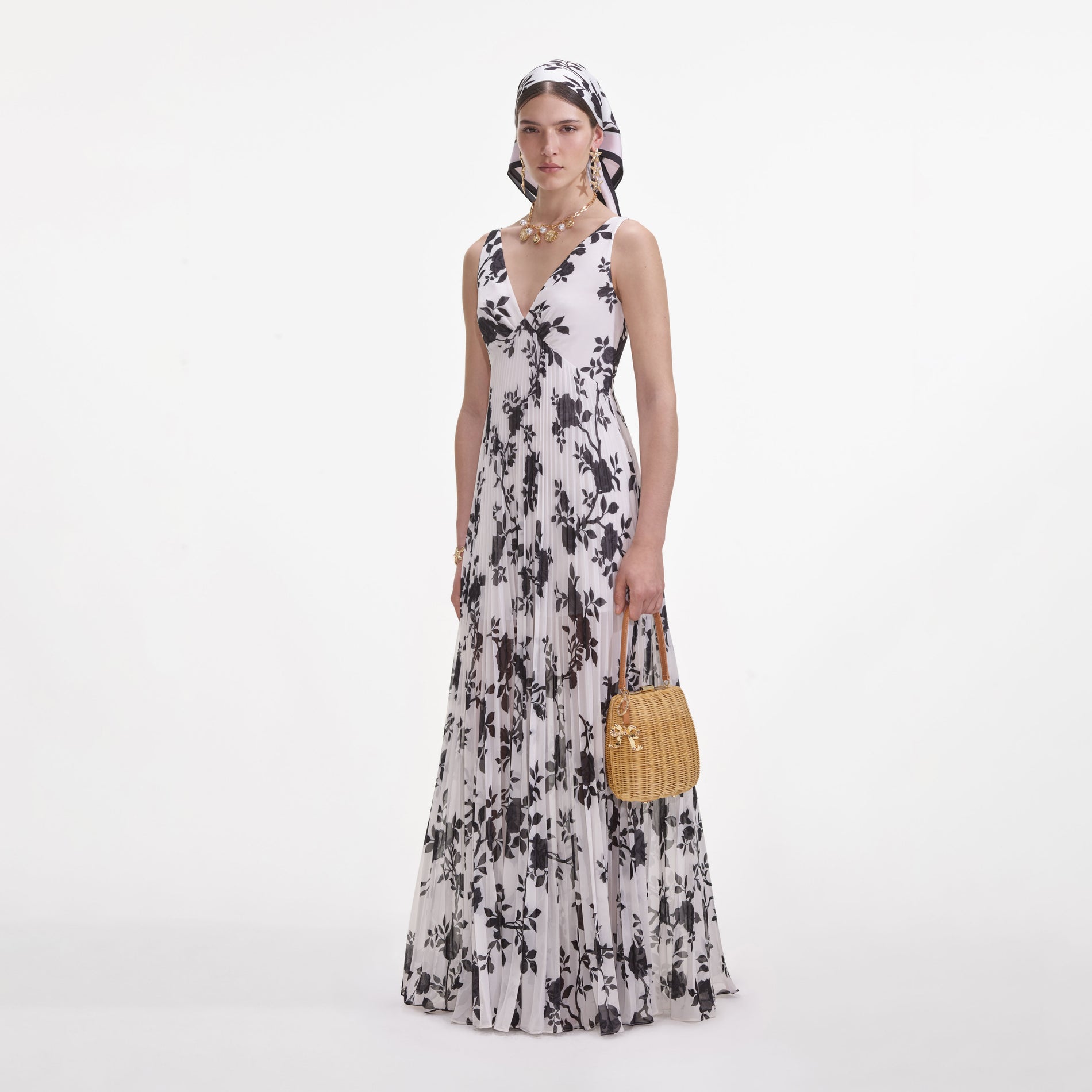 Side view of a woman wearing the Floral Print Chiffon Maxi Dress