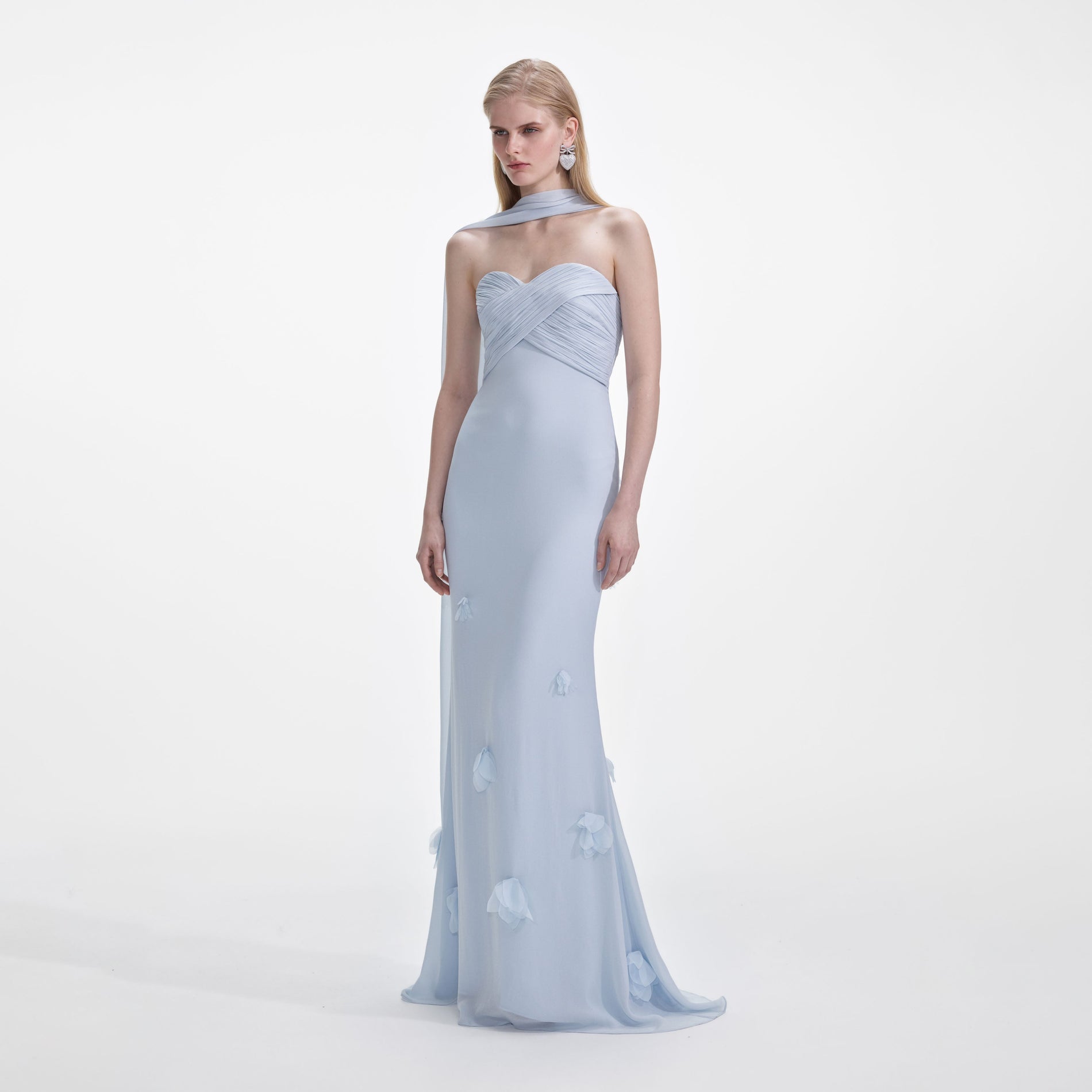 Side view of a woman wearing the Blue Georgette Flower Maxi Dress