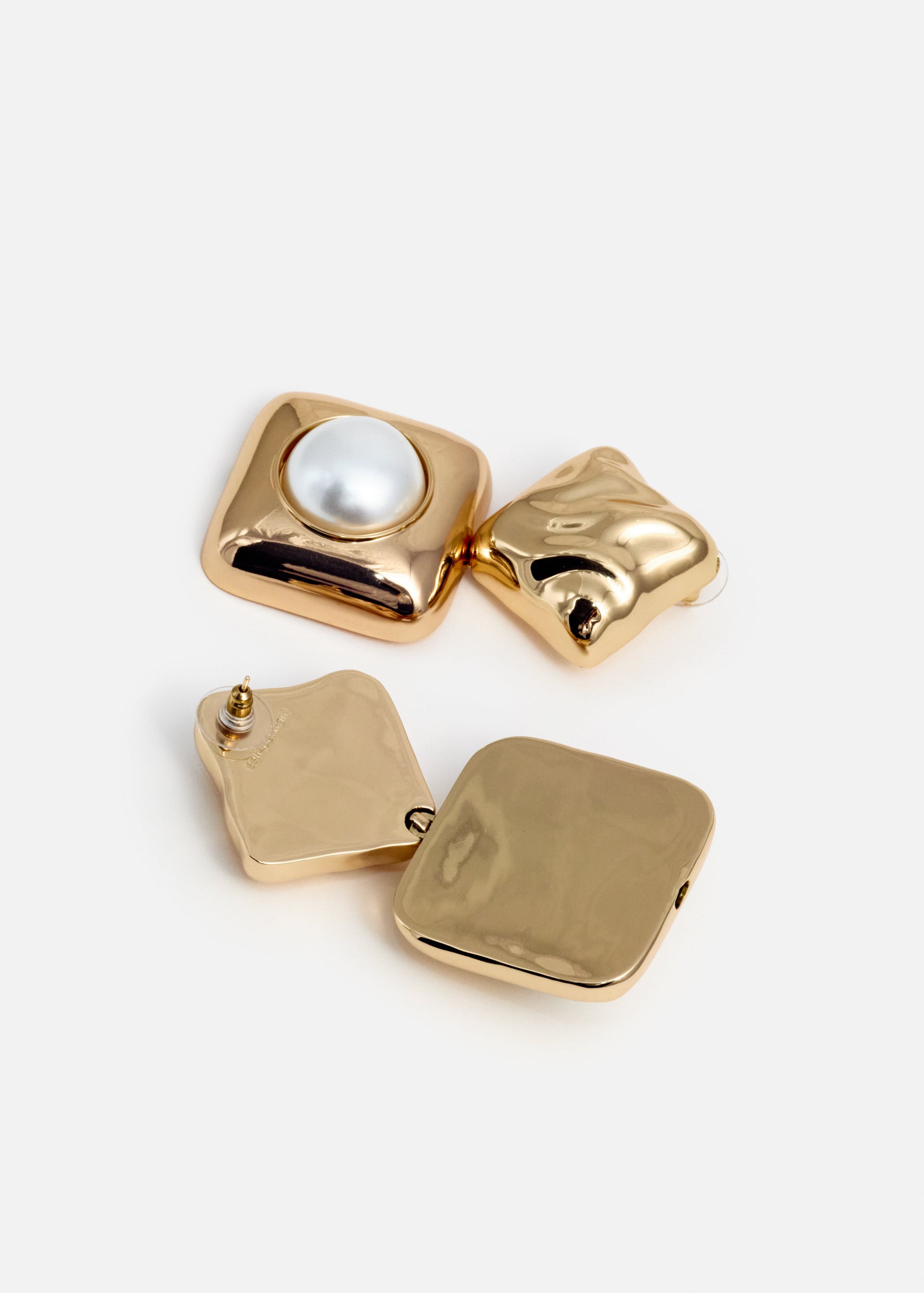 A photo of the Mottled Gold Pearl Tiered Earrings