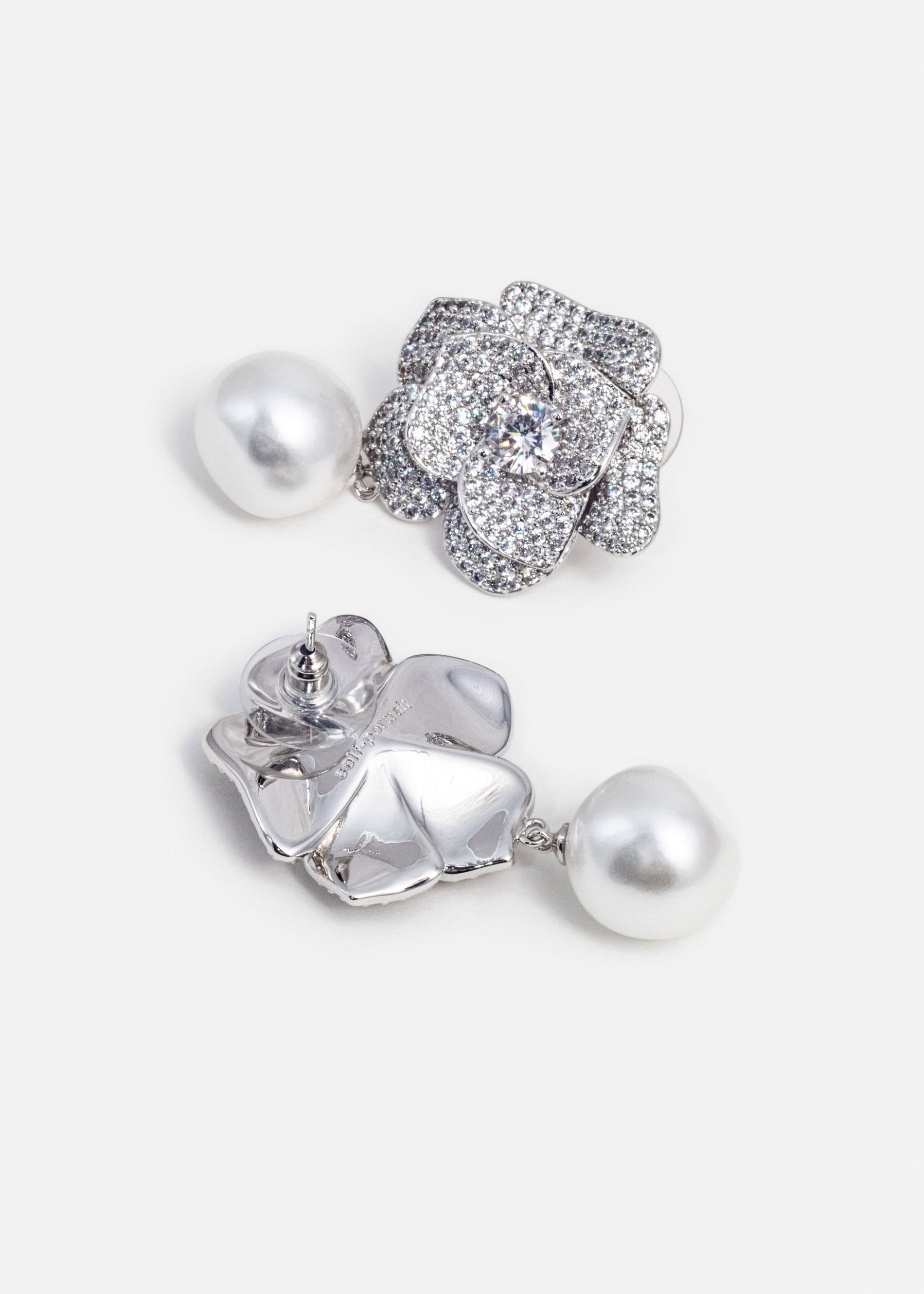 A photo of the Crystal Flower Pearl Earrings