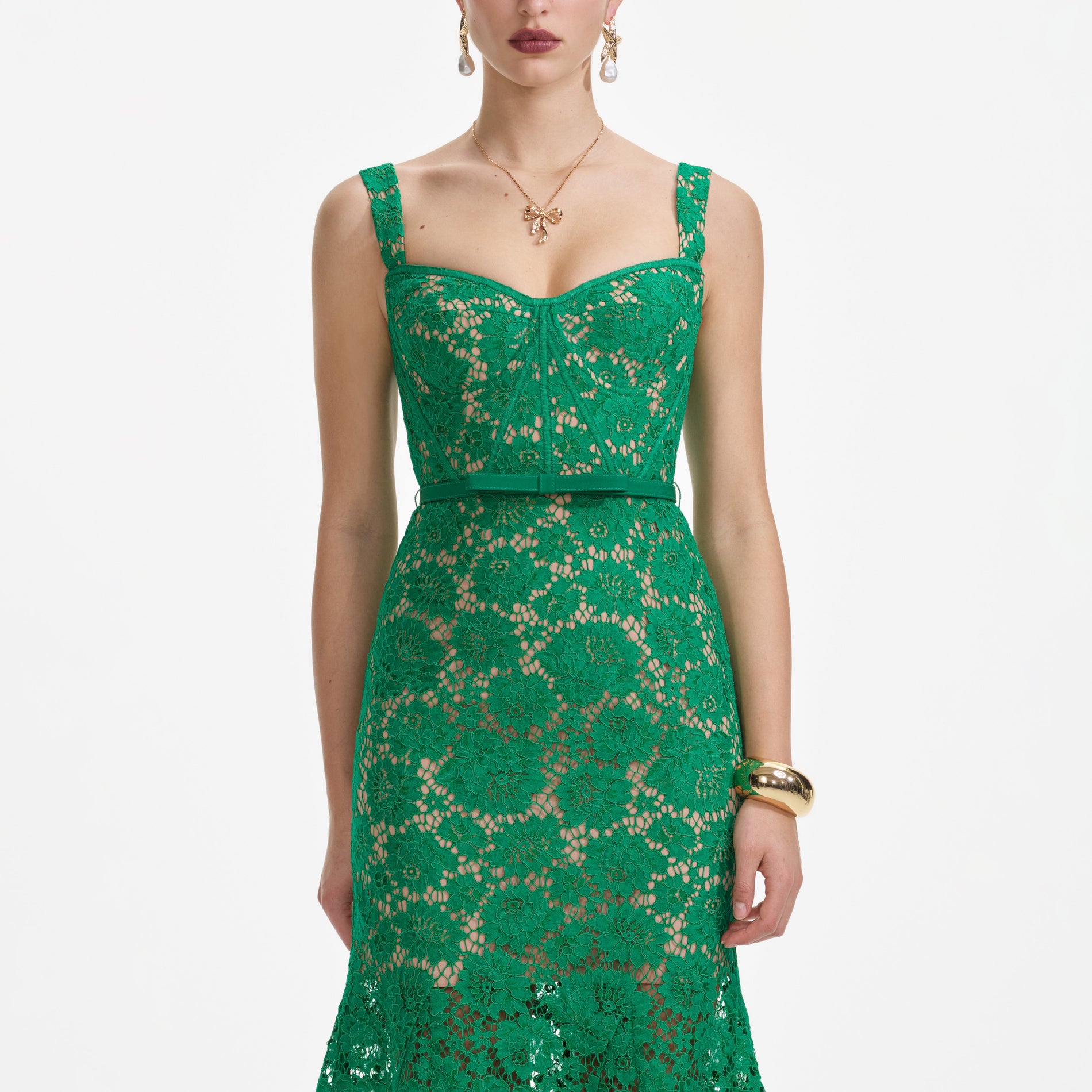 A close up of a woman wearing the Green Fine Lace Midi Dress