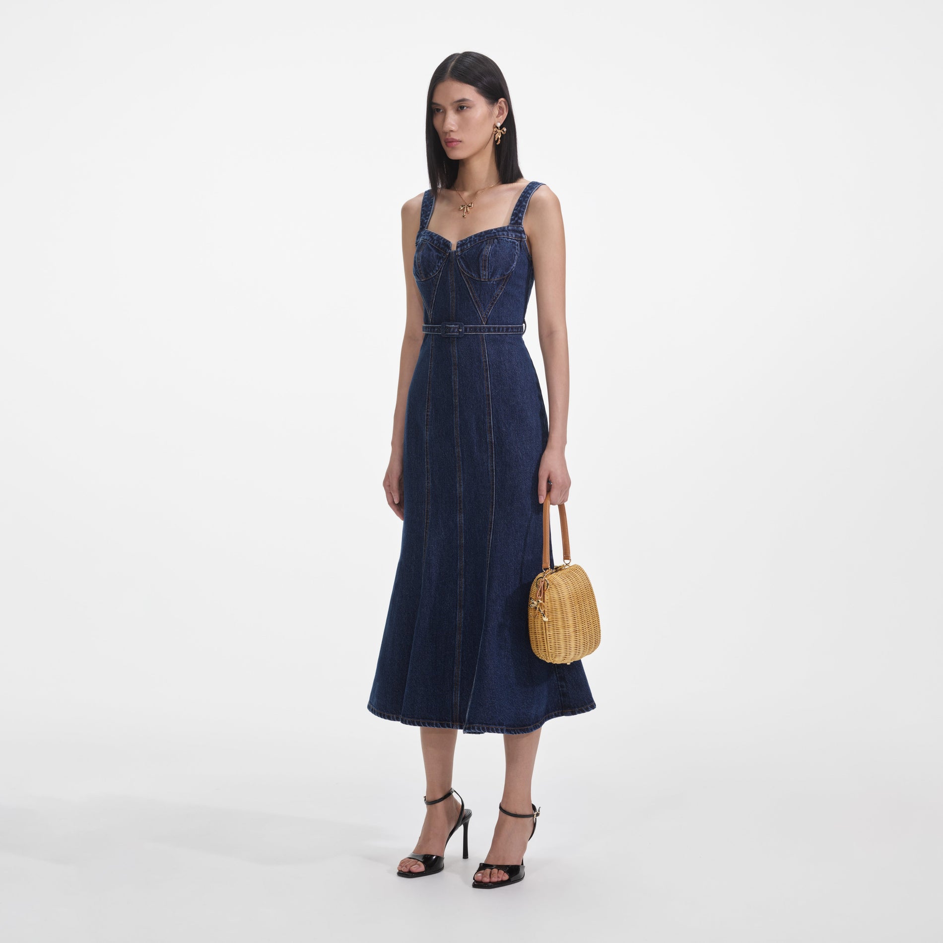 Side view of a woman wearing the Denim Sweetheart Midi Dress