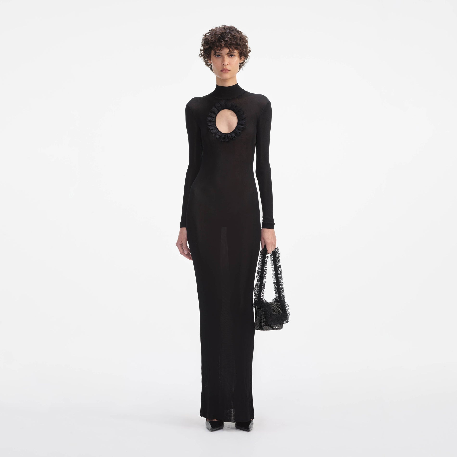 Front view of a woman wearing the Black Knit Cut Out Maxi Dress