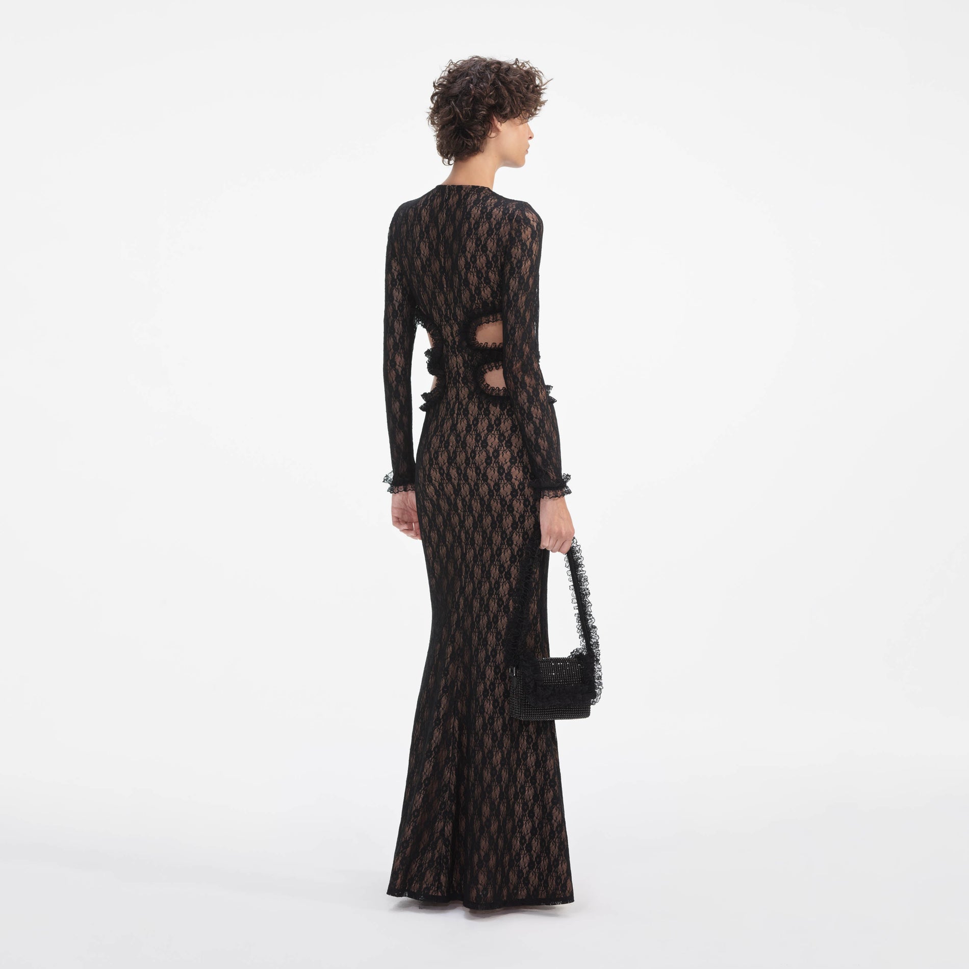 Back view of a woman wearing the Black Lace Cut Out Maxi Dress