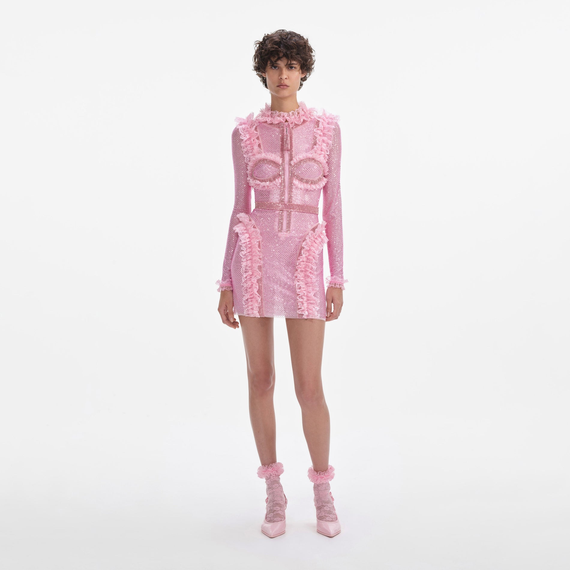 Front view of a woman wearing the Pink Rhinestone Mesh Ruffle Mini Dress