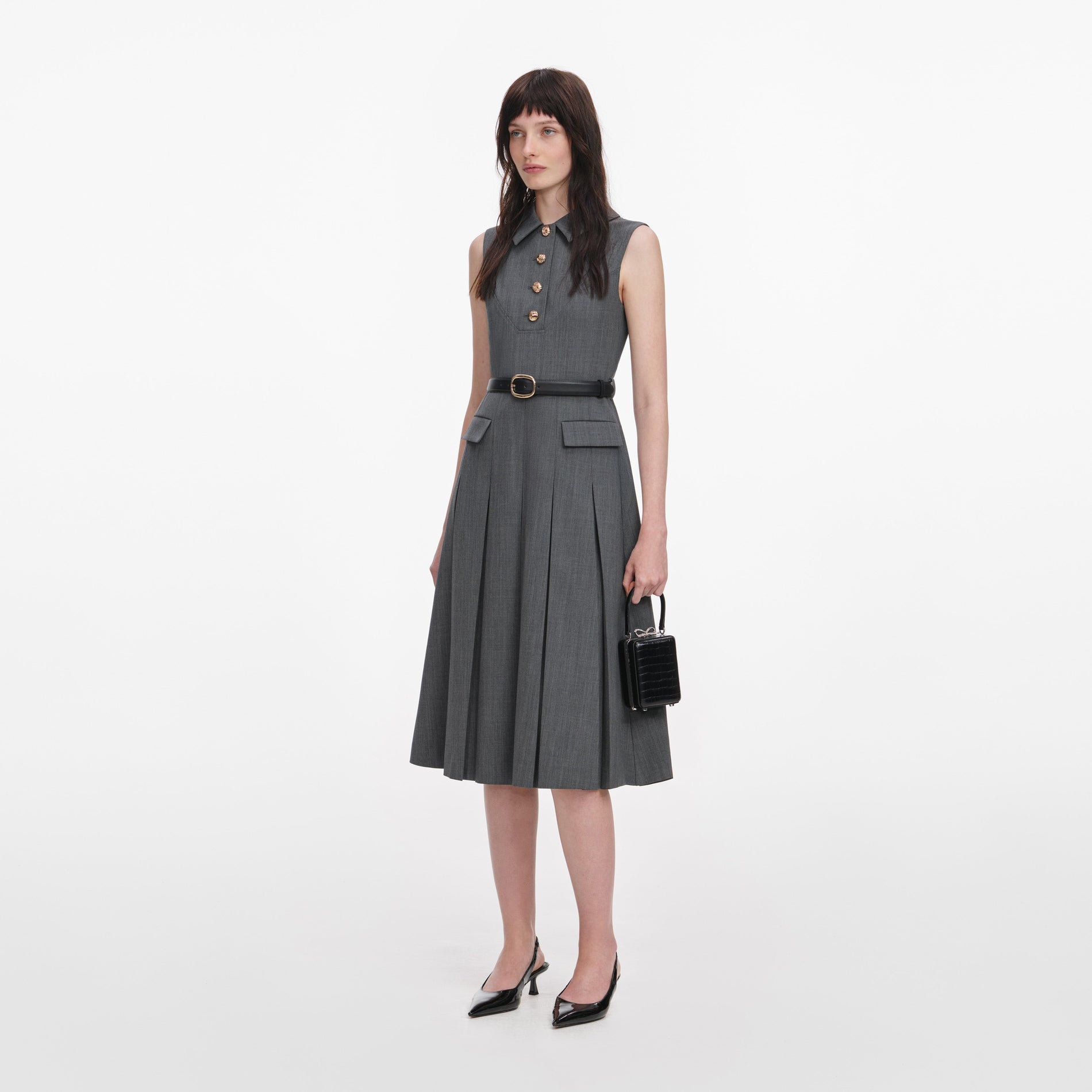 Side view of a woman wearing the Grey Tailored Pleated Midi Dress