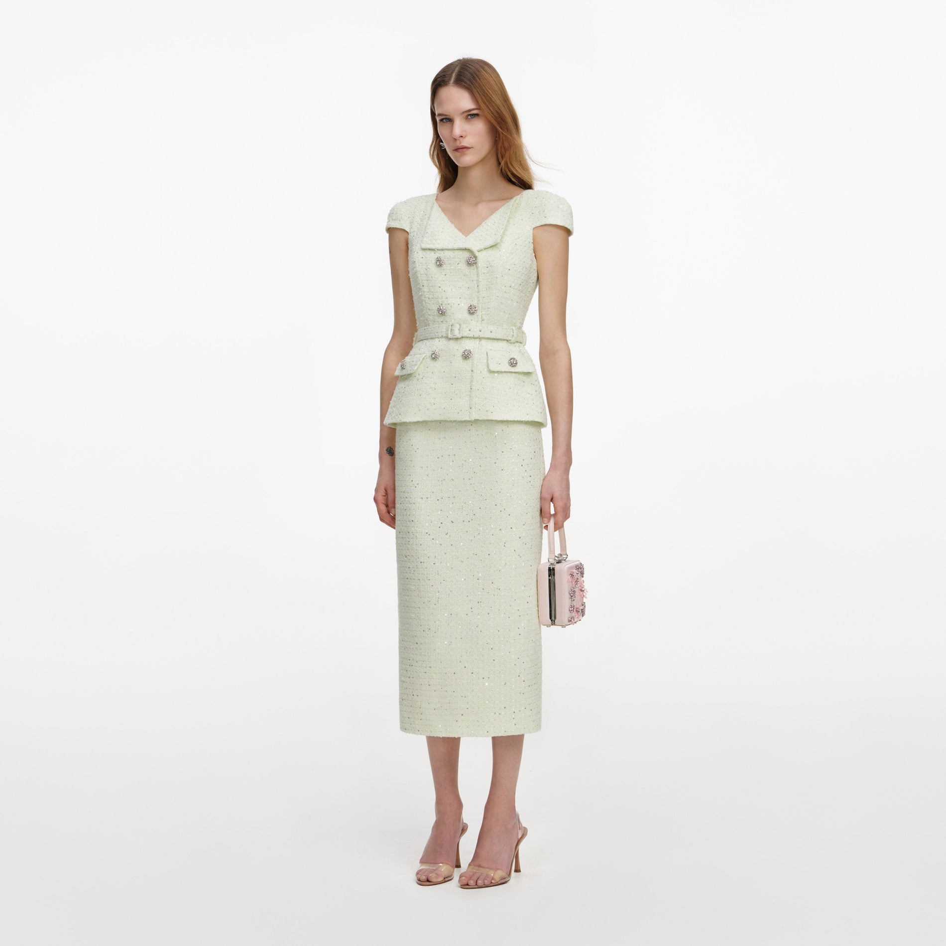 Side view of a woman wearing the Lime Boucle Midi Dress