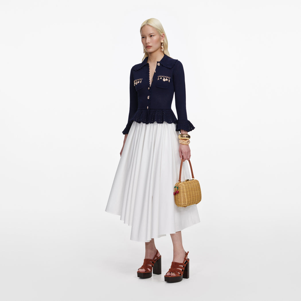 Side view of a woman wearing the Navy Shell Embellished Cardigan