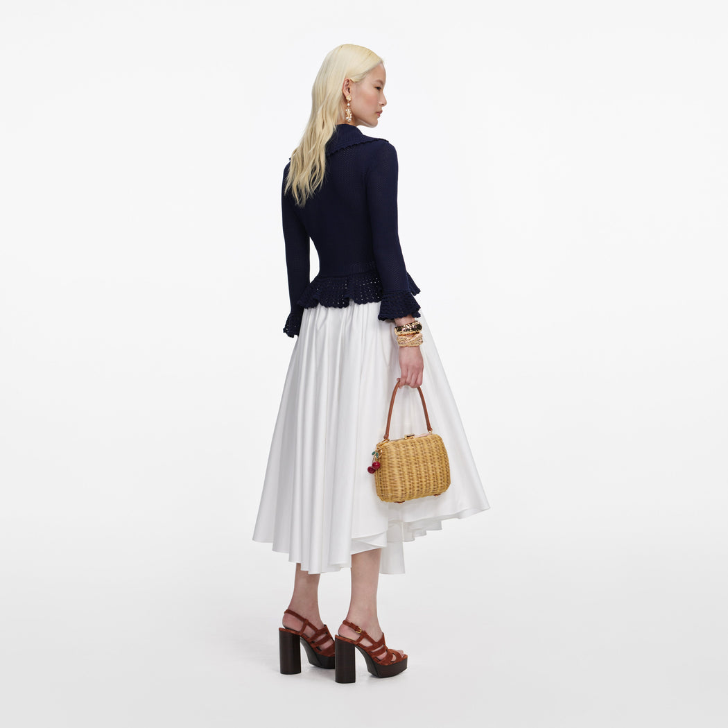 Back view of a woman wearing the Navy Shell Embellished Cardigan