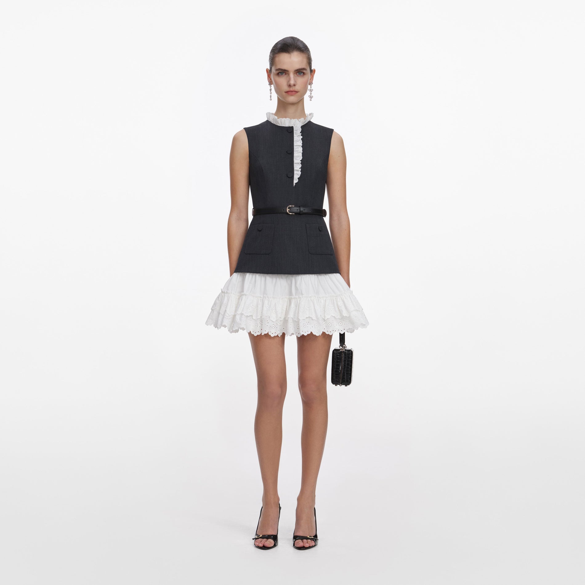 A close up of a woman wearing the Grey Tailored Cotton Frill Mini Dress