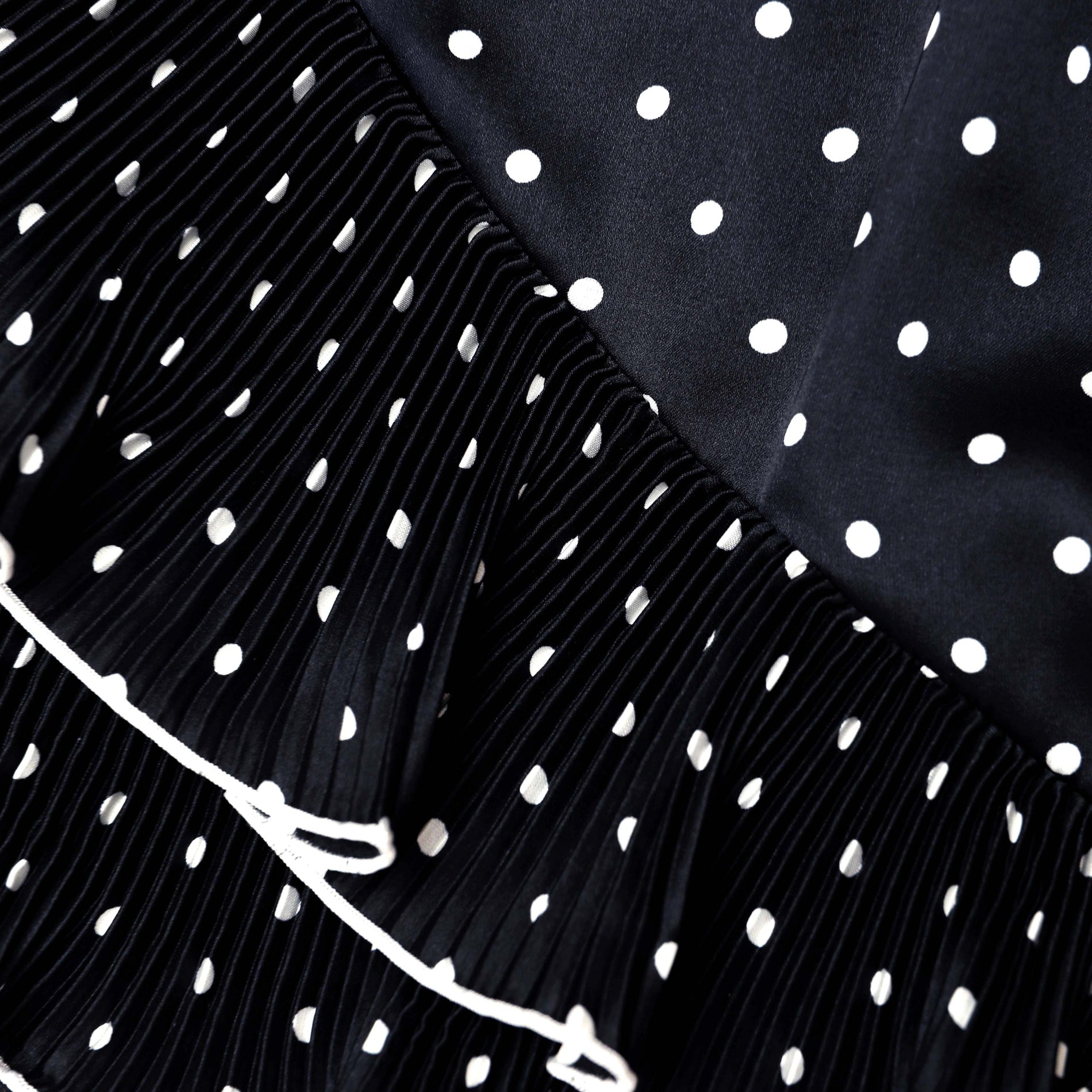 A close up of the fabric for the Black Polka Dot Frill Top