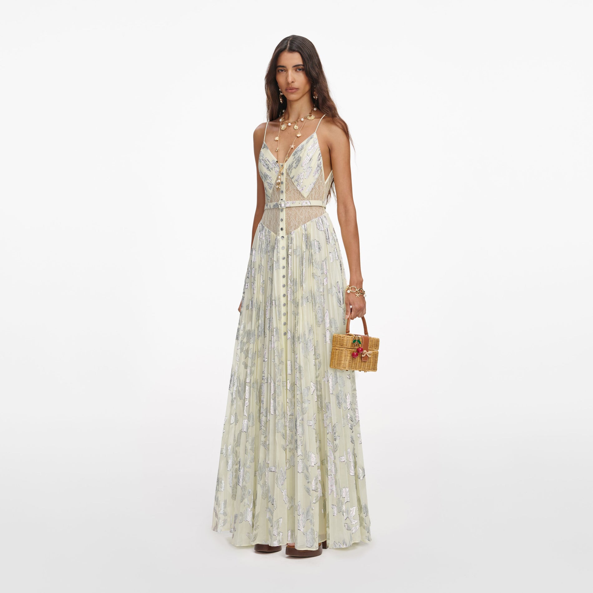 Side view of a woman wearing the Yellow Metallic Chiffon Maxi Dress