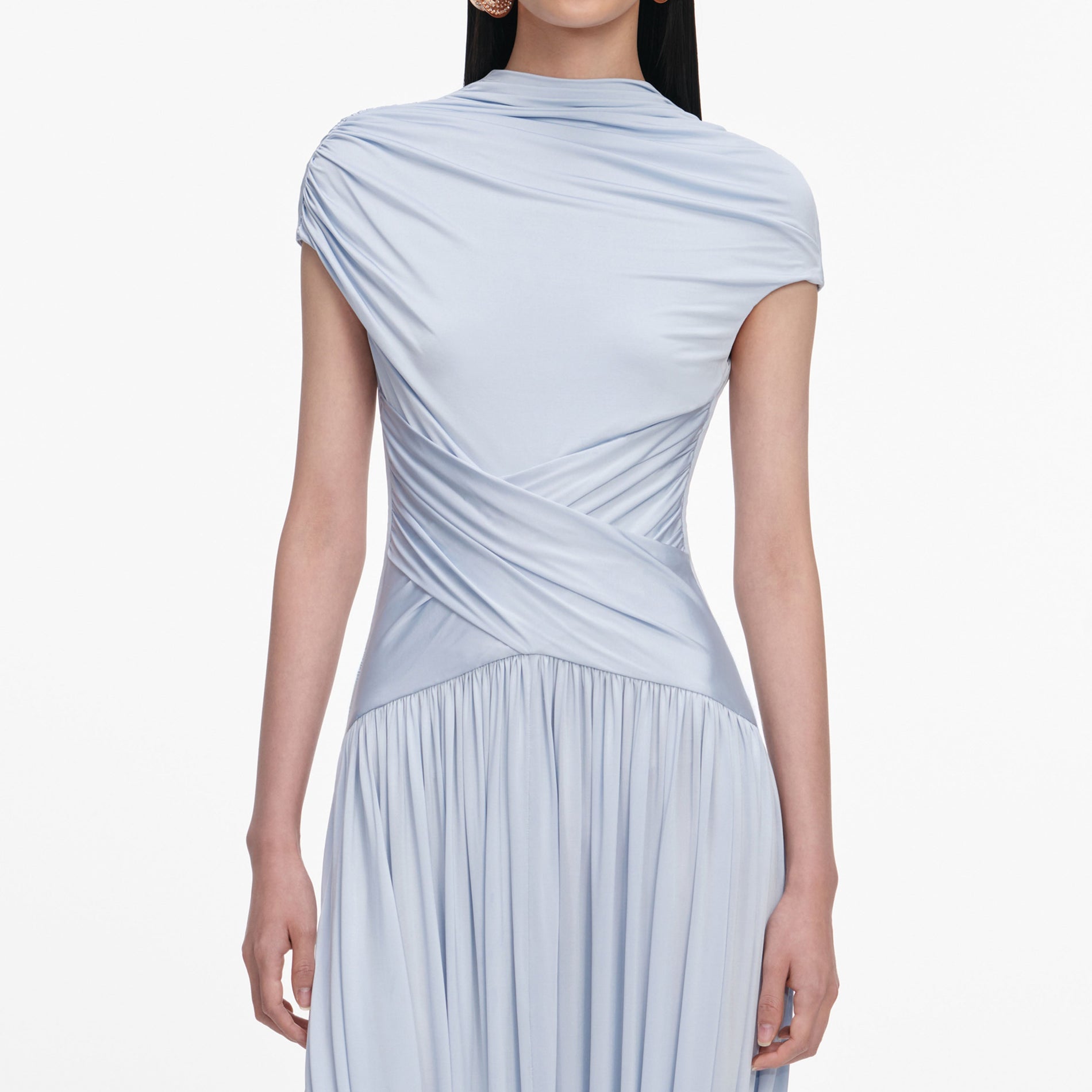 A close up of a woman wearing the Blue Jersey Gathered Midi Dress