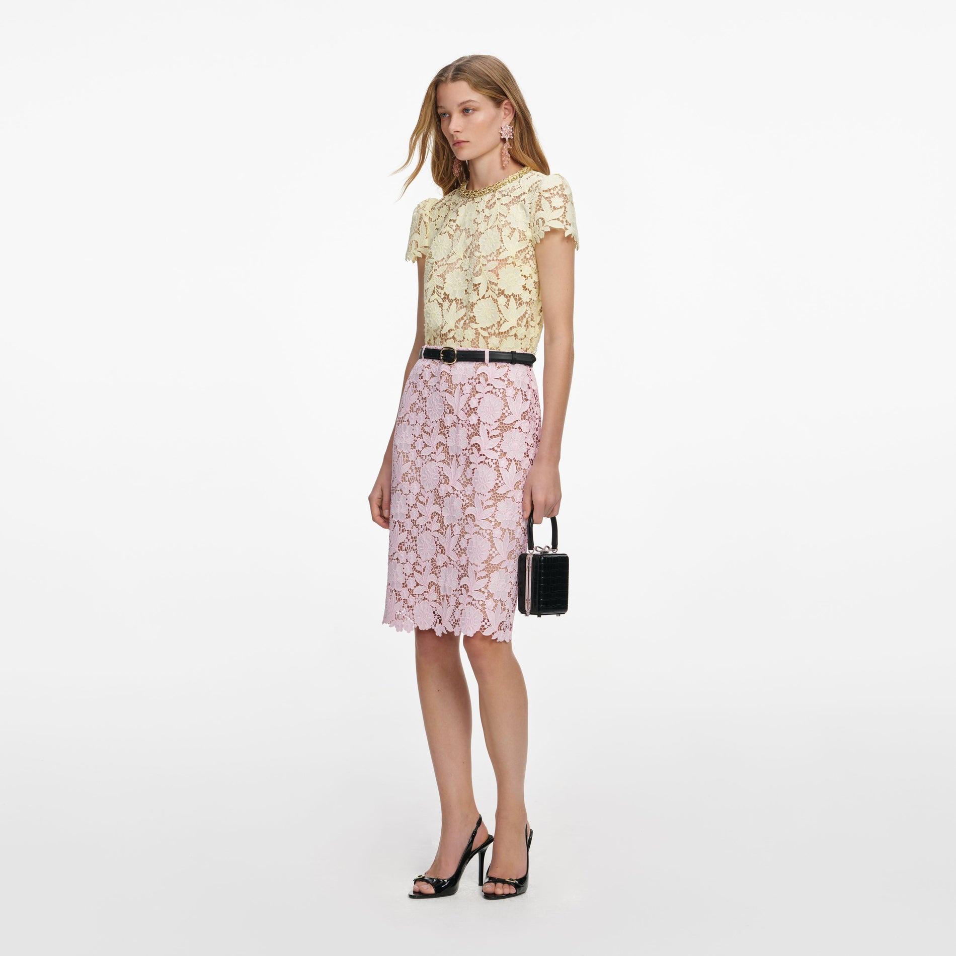 Side view of a woman wearing the Pink Lace Midi Skirt
