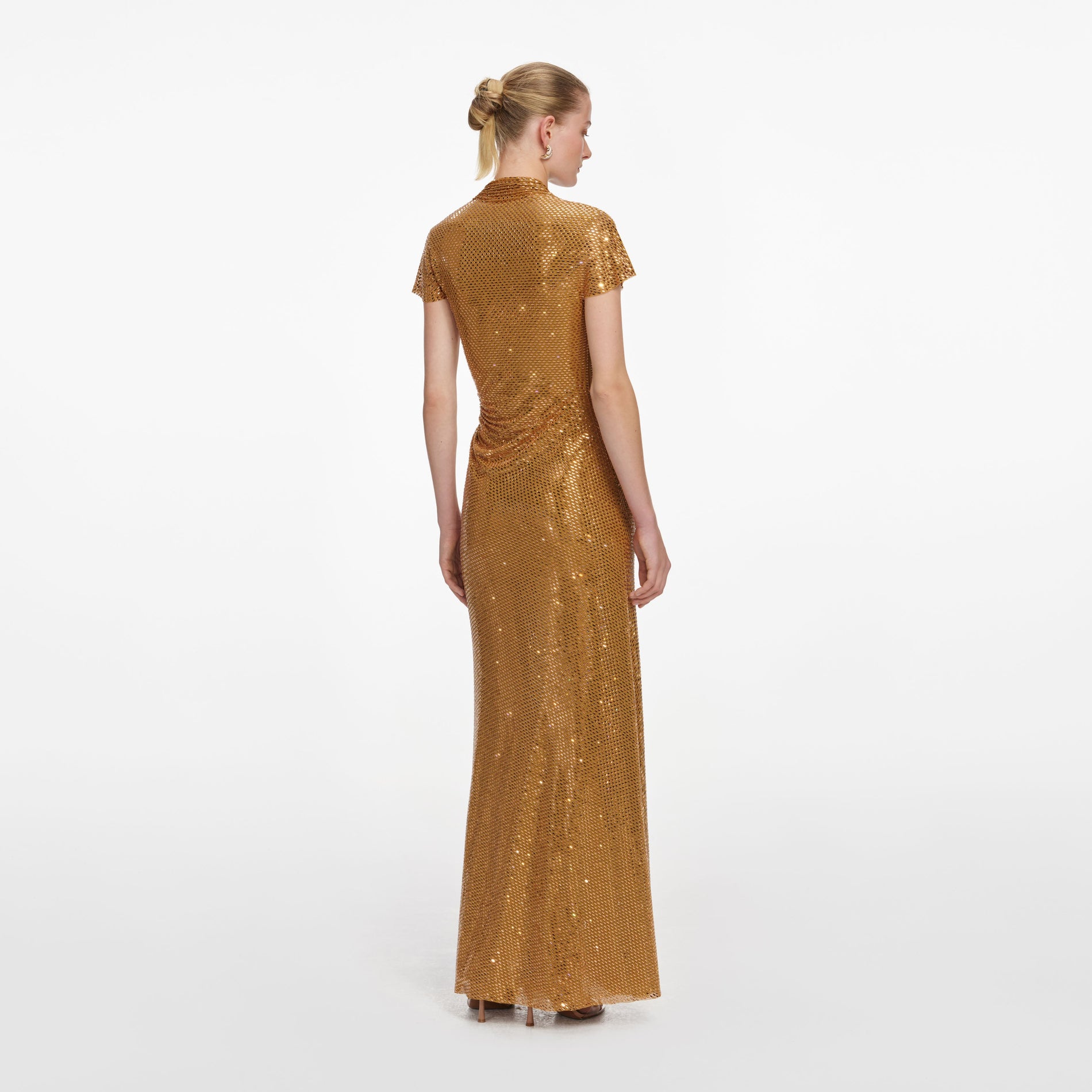 Back view of a woman wearing the Gold Rhinestone Drape Maxi Dress