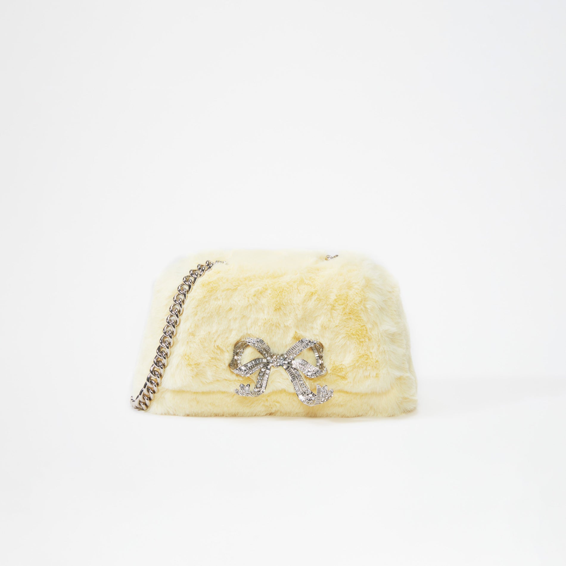 A woman wearing the Yellow Fluffy Bow Mini Bag