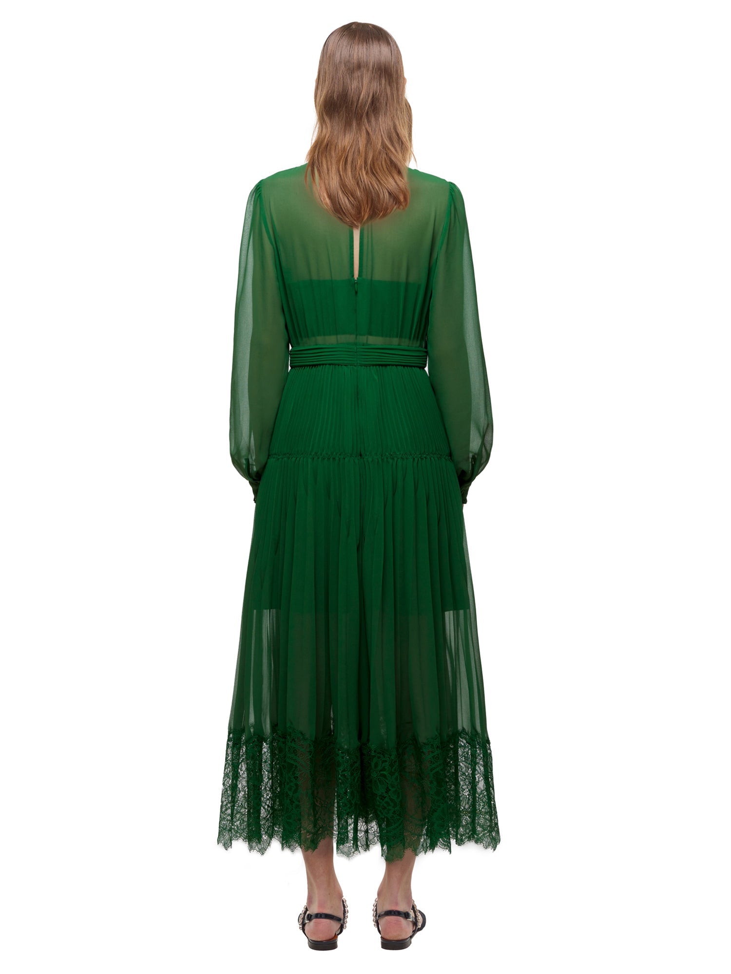 A woman wearing the Green Chiffon Trimmed Dress